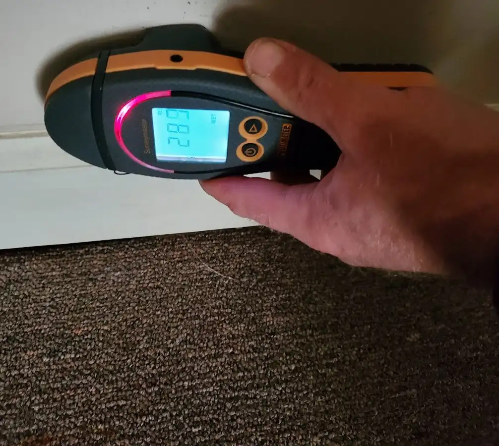 Moisture detection at baseboard during Sewage Cleanup & Sanitation in Shiprock
